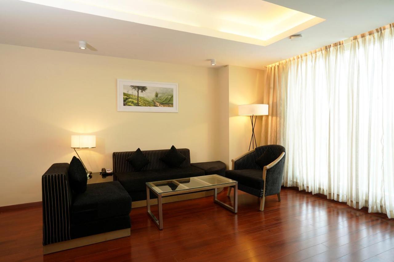 O by Tamara Thiruvananthapuram Exterior foto A living room